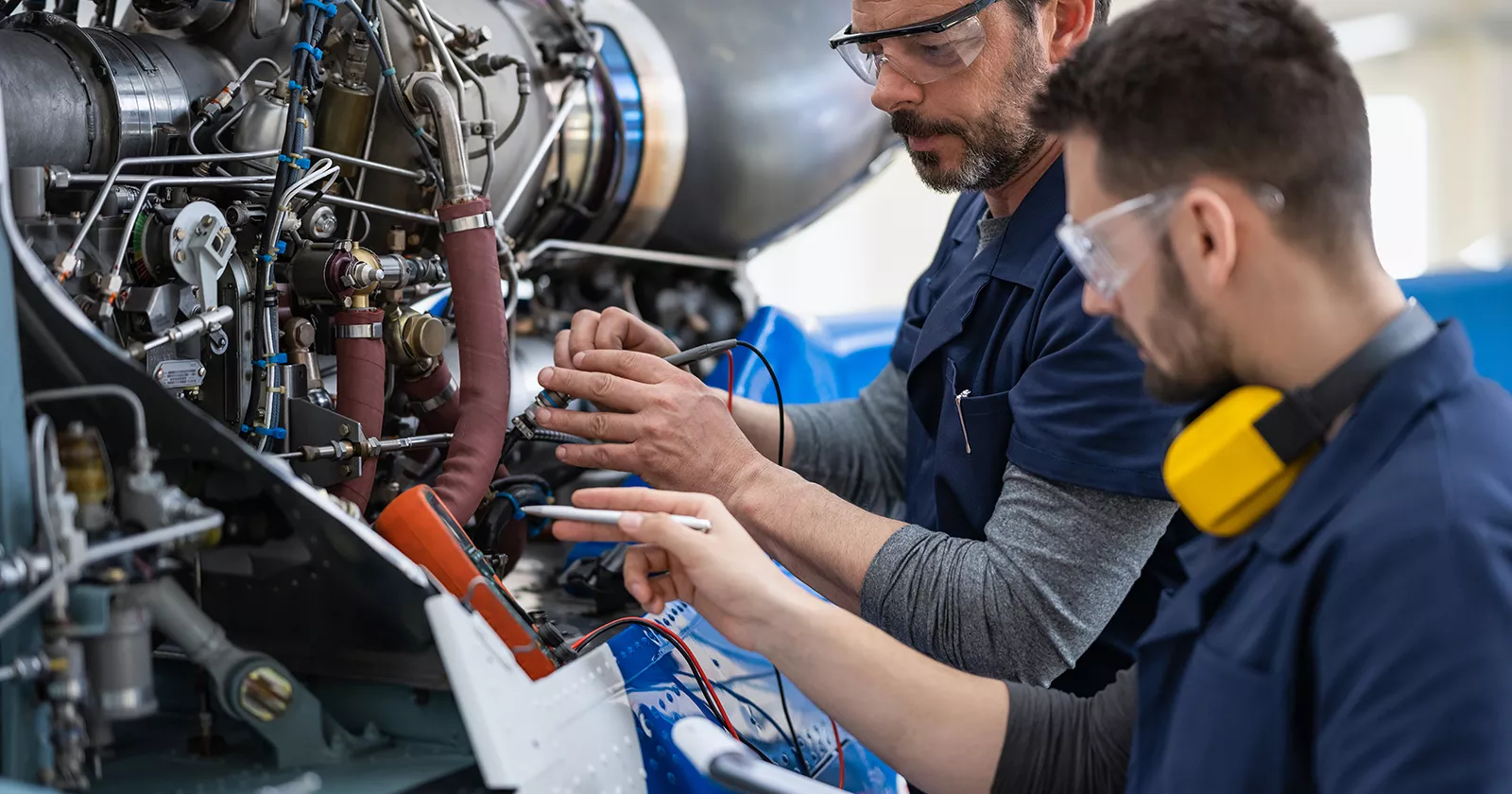 Aviation engineers working on an aircraft